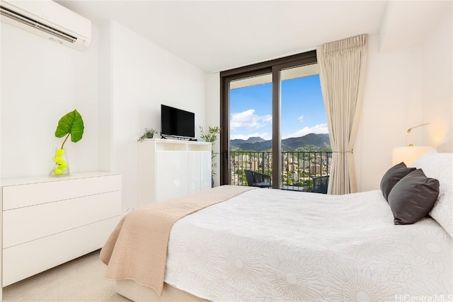 carpeted bedroom featuring a wall mounted air conditioner and access to outside