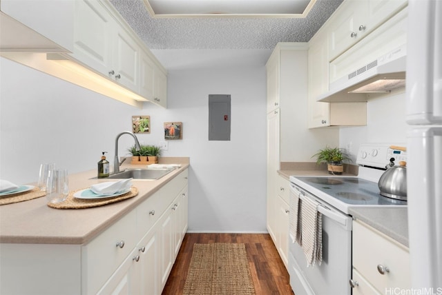 kitchen with range with electric cooktop, sink, exhaust hood, electric panel, and white cabinetry