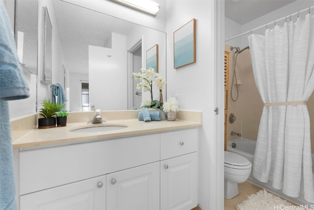 full bathroom with a textured ceiling, vanity, shower / bath combo, and toilet