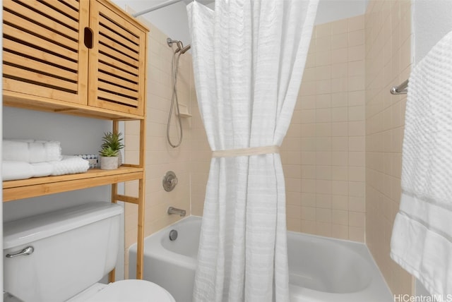 bathroom featuring shower / bath combo and toilet