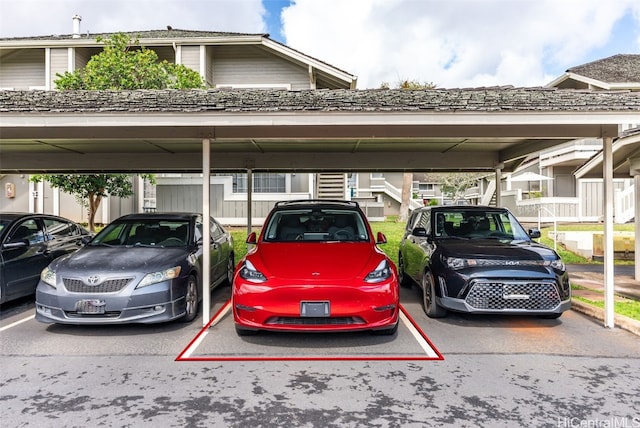 view of parking / parking lot featuring a carport