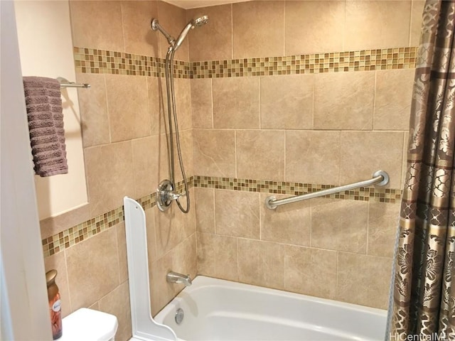 bathroom with shower / bath combination with curtain and toilet