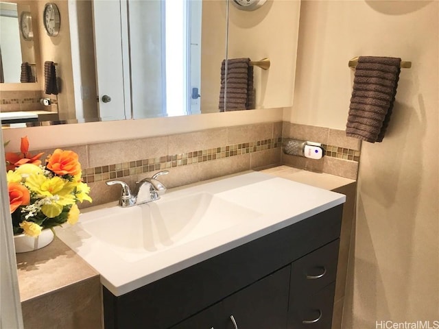 bathroom featuring backsplash and vanity