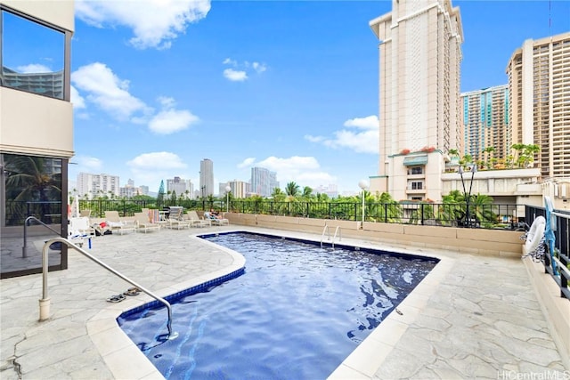 view of pool featuring a patio area