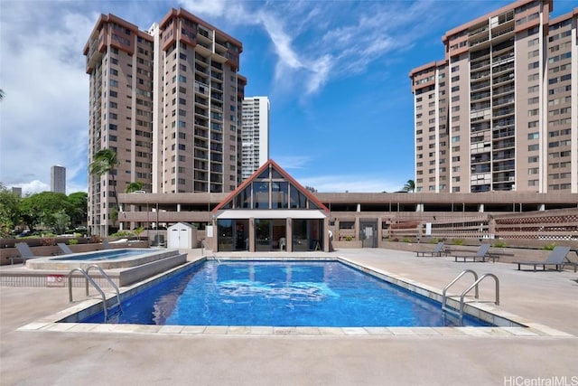 view of swimming pool with a patio area