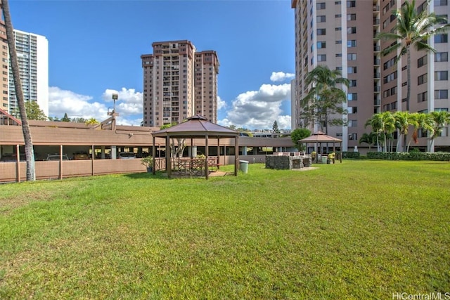 view of home's community with a gazebo and a yard