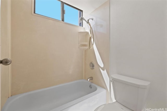 bathroom with toilet and shower / bath combination