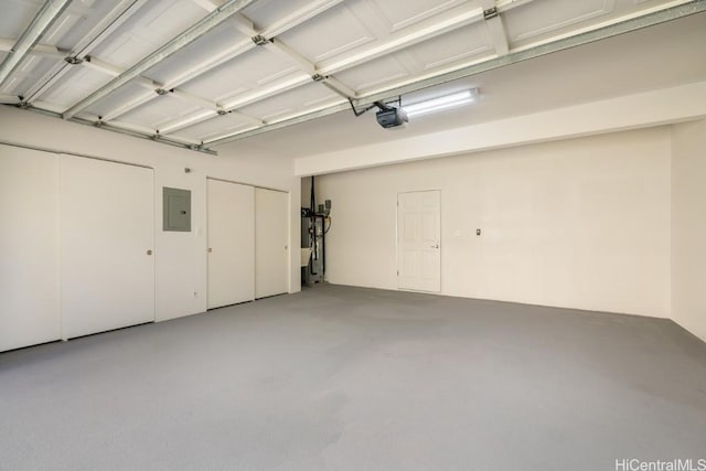 garage featuring a garage door opener and electric panel