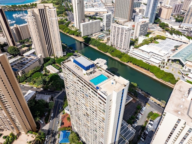 birds eye view of property with a water view