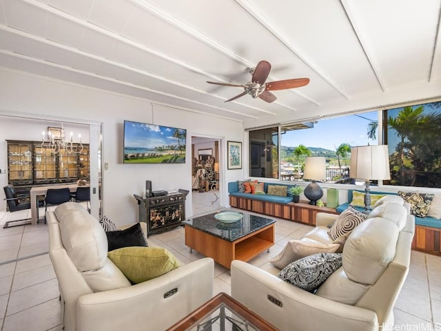 interior space with light tile patterned floors and ceiling fan with notable chandelier