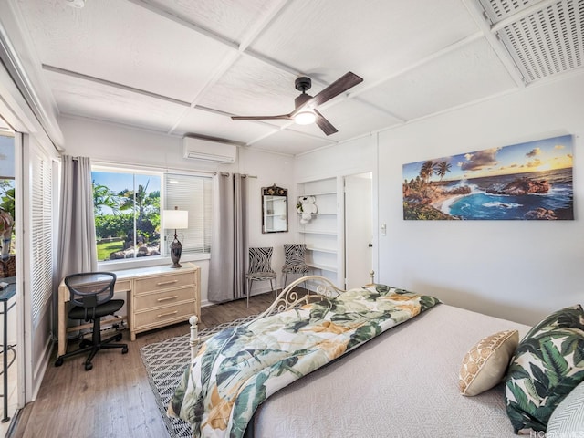 654 N Judd St Unit 654, Honolulu, HI 96817 - bedroom with a wall mounted air conditioner, wood finished floors, and a ceiling fan