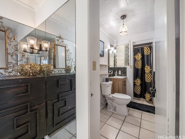 bathroom with tile patterned floors, vanity, and toilet