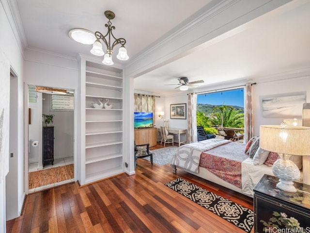 bedroom featuring ceiling fan with notable chandelier, dark hardwood / wood-style flooring, and ornamental molding