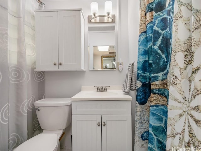 bathroom with vanity and toilet