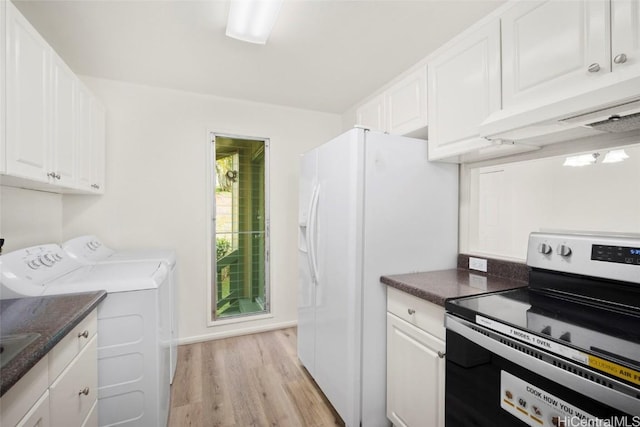 kitchen with white cabinets, washing machine and dryer, electric stove, and light hardwood / wood-style flooring