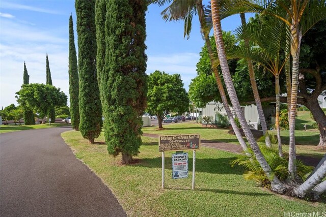 surrounding community featuring a yard