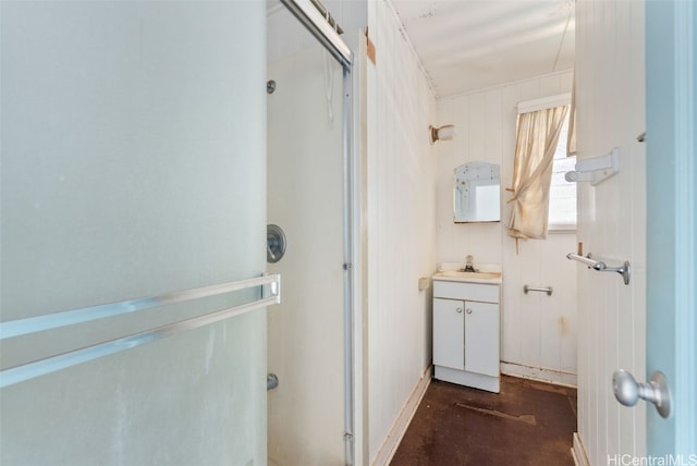 bathroom with vanity, walk in shower, and concrete floors