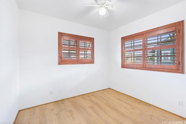 unfurnished room with light hardwood / wood-style flooring and ceiling fan