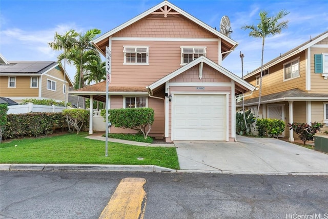 craftsman inspired home with a garage and a front lawn