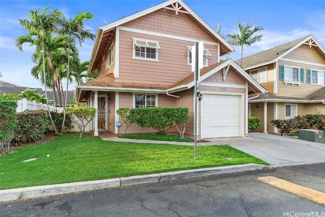 craftsman-style house featuring a front yard and a garage