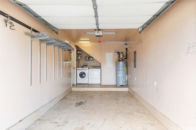 garage featuring washing machine and clothes dryer, a garage door opener, and water heater