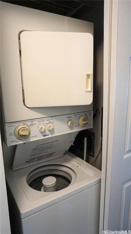 washroom with stacked washer / dryer