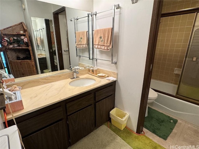 full bathroom with vanity, toilet, and bath / shower combo with glass door