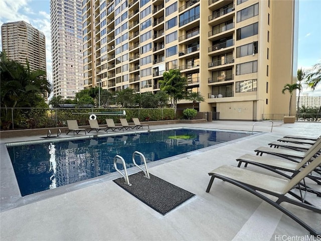 view of swimming pool featuring a patio area