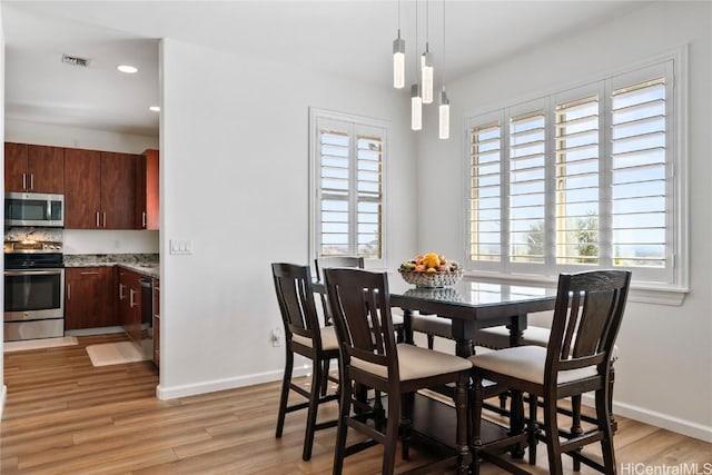 dining room featuring light wood-type flooring