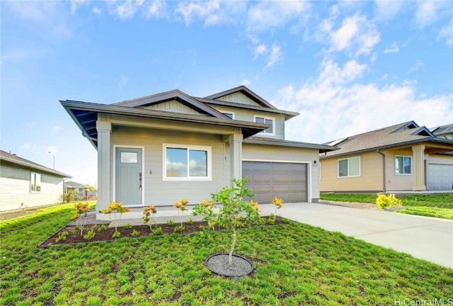 view of front of home featuring a garage and a front yard