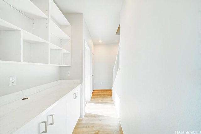 hallway with light wood-type flooring