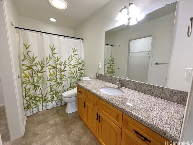 bathroom with tile patterned floors, vanity, a notable chandelier, and toilet