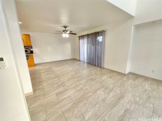 spare room featuring ceiling fan