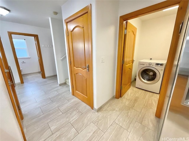 clothes washing area featuring washer / clothes dryer