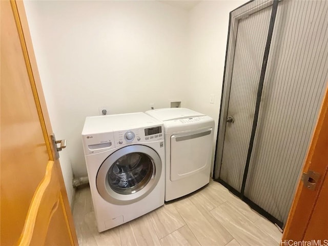 washroom with washer and dryer