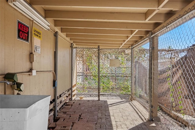 unfurnished sunroom with sink