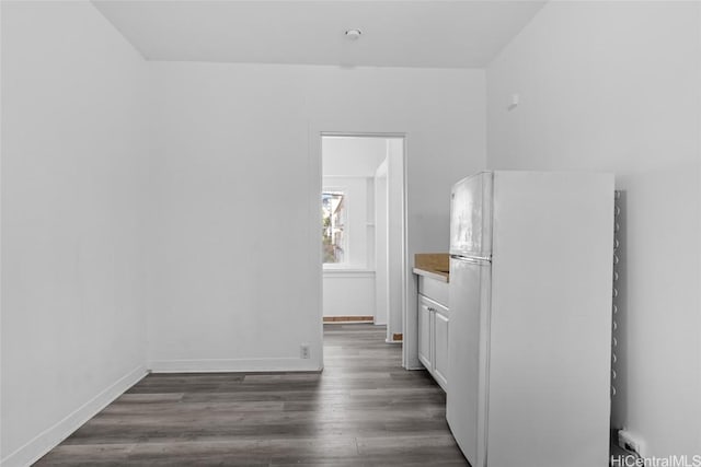 empty room featuring dark wood-type flooring