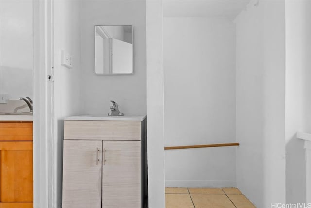 bathroom with tile patterned floors and vanity