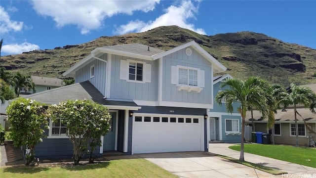 view of front of house with a mountain view and a garage