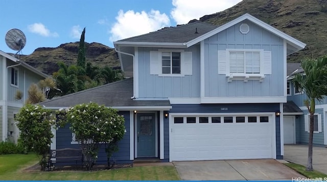 view of front of house with a mountain view and a garage