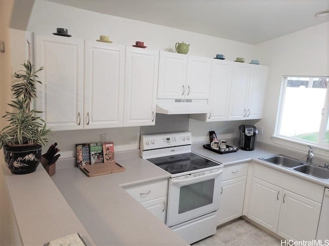 kitchen featuring white cabinetry, sink, and white appliances