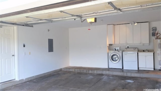 garage with washer and clothes dryer, electric panel, a garage door opener, sink, and water heater