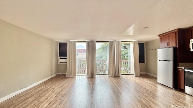 unfurnished living room with light hardwood / wood-style flooring