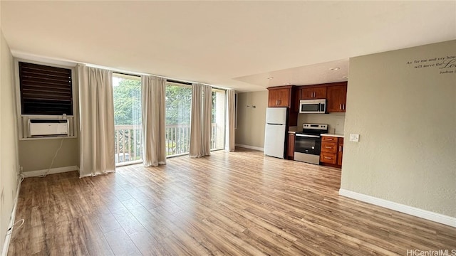 unfurnished living room featuring light hardwood / wood-style floors