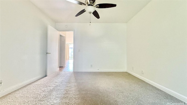 empty room featuring carpet floors and ceiling fan