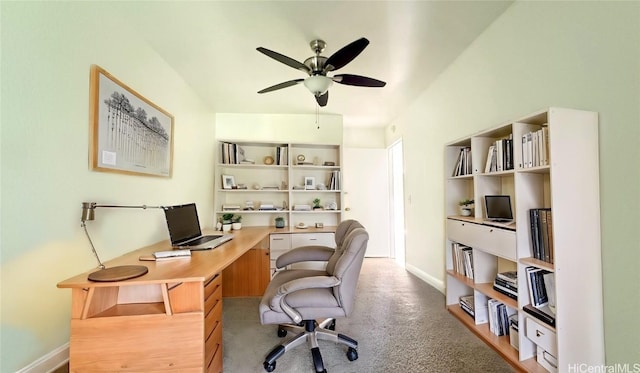 carpeted office featuring ceiling fan