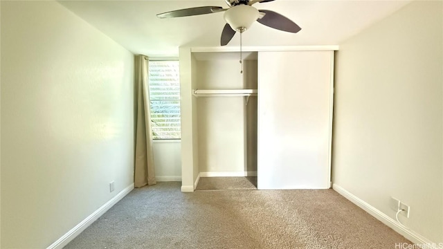 unfurnished bedroom featuring ceiling fan and a closet