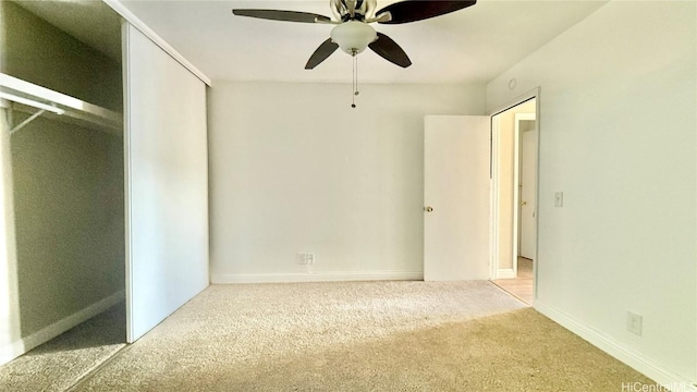 unfurnished bedroom with ceiling fan and carpet floors