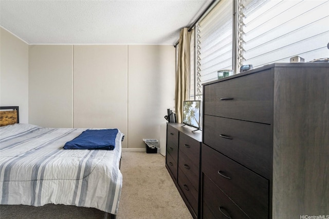 95-2031 Waikalani Pl Unit D906, Mililani, HI 96789 - bedroom featuring light colored carpet, multiple windows, and a textured ceiling