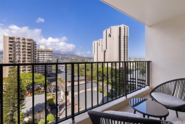 balcony featuring a city view